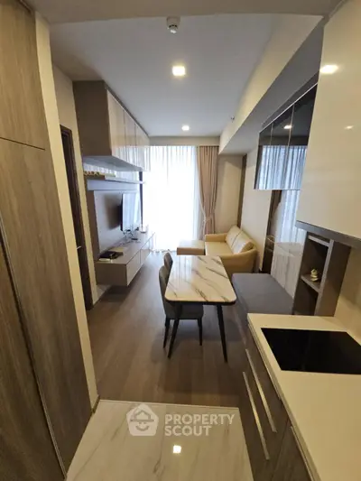 Modern open-layout living room with stylish furniture and natural light