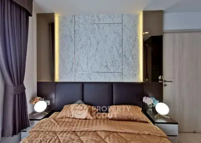 Luxurious bedroom with elegant marble accent wall and ambient lighting