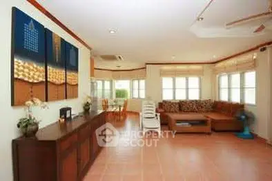Spacious living room with modern decor and large windows for natural light.