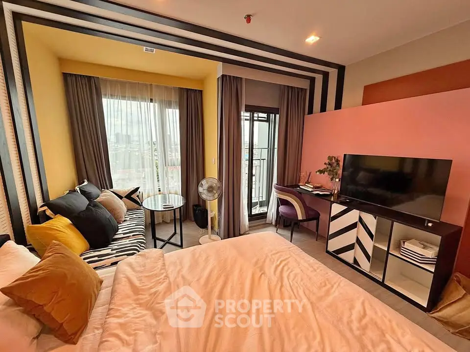 Stylish modern bedroom with vibrant decor and balcony view
