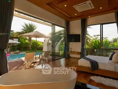Luxurious bedroom with pool view and modern bathtub, perfect for relaxation and comfort.