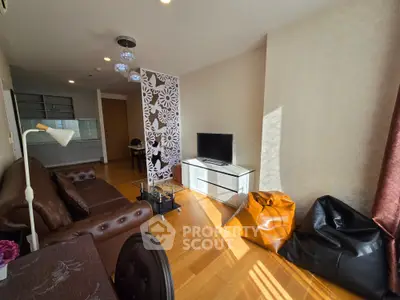 Spacious living room with modern decor and natural light