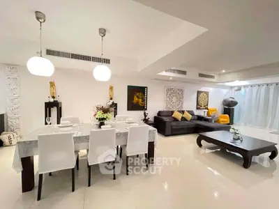 Spacious modern living room with elegant dining area and stylish decor