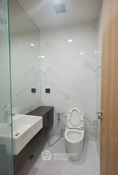 Modern bathroom with sleek fixtures and elegant marble walls