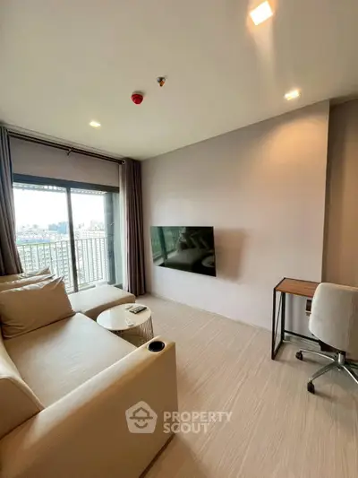 Modern living room with city view, cozy sofa, and wall-mounted TV