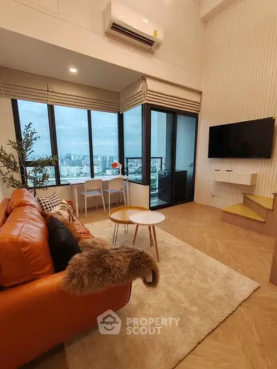Modern living room with stunning city view, featuring leather sofa and wall-mounted TV.