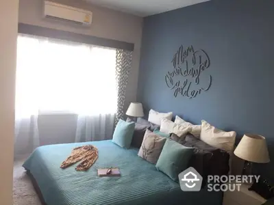 Cozy bedroom with blue accent wall and stylish decor