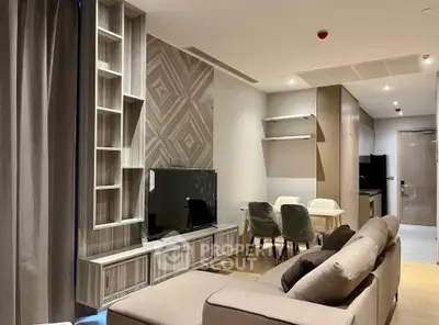 Modern living room with stylish decor and open layout, featuring a cozy sofa and dining area.
