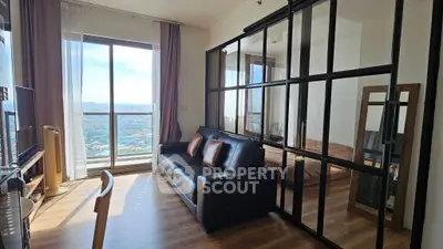 Modern living room with glass partition and stunning city view