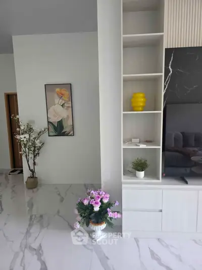 Elegant living room with modern decor and marble flooring