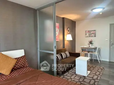 Modern studio apartment with cozy living area and stylish decor