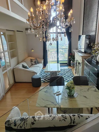 Luxurious living room with chandelier and city view, featuring elegant decor and modern furnishings.