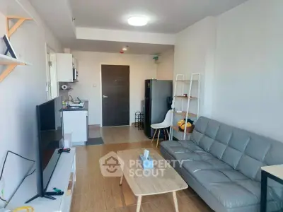 Modern living room with sleek furniture and open kitchen layout