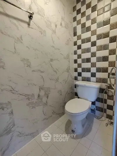 Modern bathroom with stylish tile design and sleek fixtures