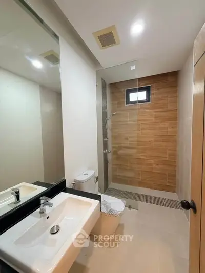 Modern bathroom with sleek design and glass shower enclosure