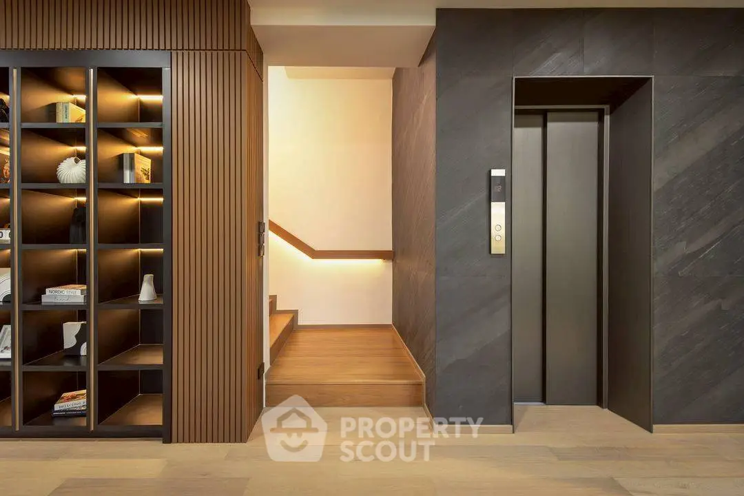 Modern elevator lobby with stylish wooden accents and ambient lighting