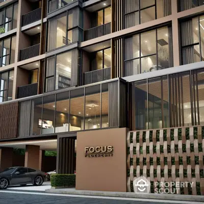 Modern luxury condominium exterior with sleek design and large windows in urban setting.