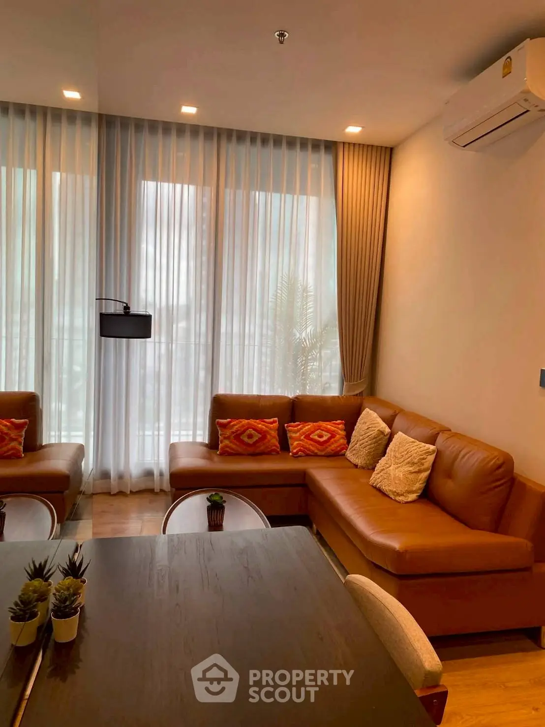Stylish living room with cozy leather sofa and modern decor in a bright apartment.