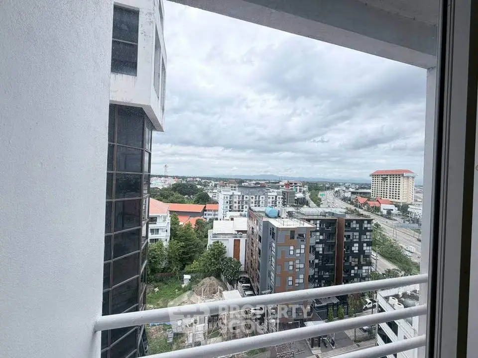 Stunning cityscape view from a high-rise balcony, showcasing modern architecture and expansive skyline.