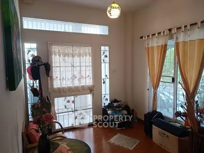 Cozy living room with floral decor and natural light