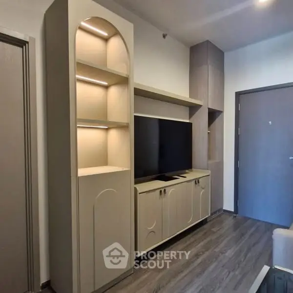 Modern living room with sleek TV unit and stylish shelving