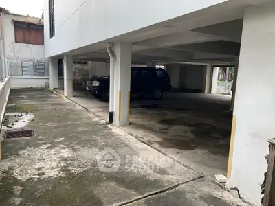 Covered parking area with ample space in residential building
