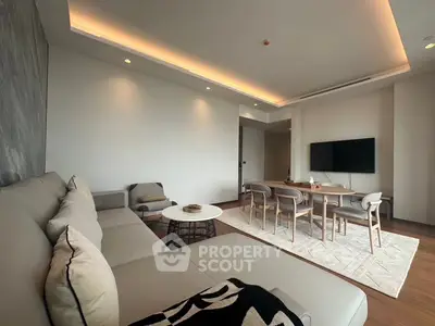 Modern living room with stylish furniture and ambient lighting, perfect for relaxation and entertainment.