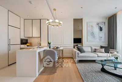 Luxurious open-plan living room and kitchen with modern decor and elegant lighting.