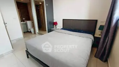 Modern bedroom with ensuite bathroom and sleek design in a contemporary apartment.