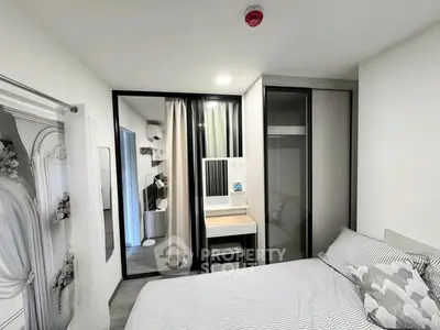 Modern bedroom with stylish decor and ample storage space