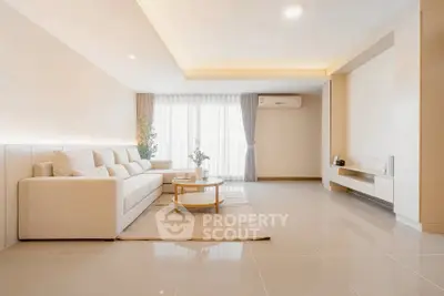 Spacious modern living room with elegant decor and natural light