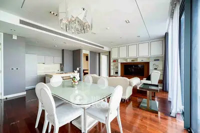 Luxurious modern living room with elegant dining area and open kitchen layout