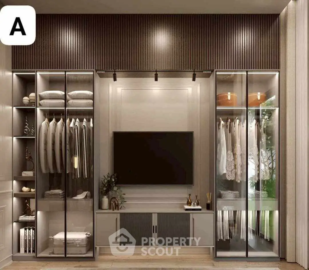 Luxurious modern walk-in closet with glass doors and elegant lighting.