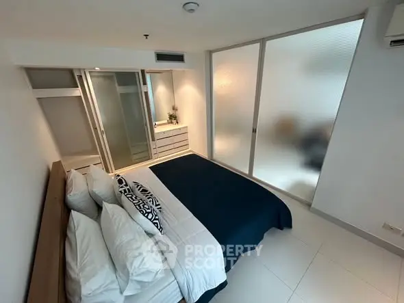 Modern bedroom with sleek design and ample natural light