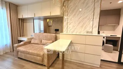 Modern living room with elegant decor and open kitchen layout