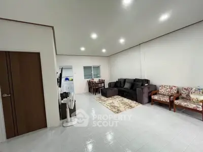 Spacious living room with modern furniture and bright lighting