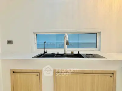 Modern kitchen with sleek sink and minimalist design