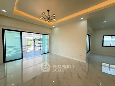 Spacious modern living room with elegant lighting and marble flooring