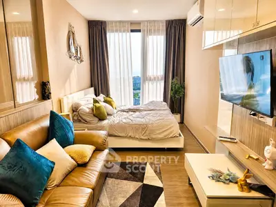 Modern cozy bedroom with stylish decor and natural light, featuring a comfortable bed and elegant furnishings.