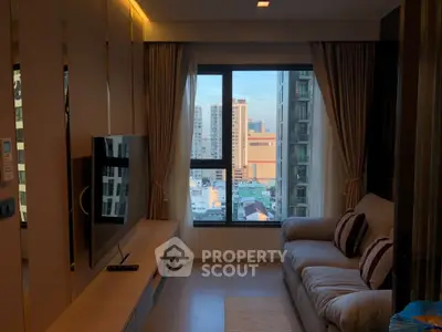 Modern living room with city view, featuring a cozy sofa and wall-mounted TV, perfect for urban living.