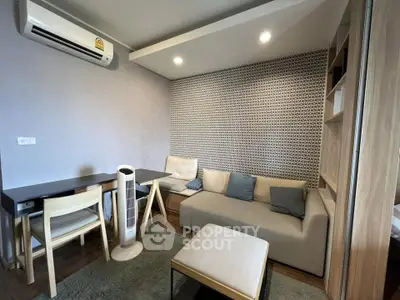 Modern living room with stylish decor and air conditioning in a cozy apartment.