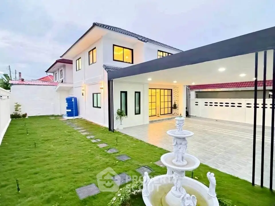 Stunning two-story home with spacious garden and elegant fountain, perfect for family living.