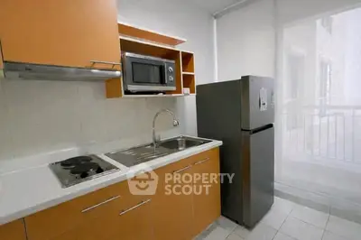 Modern kitchen with sleek cabinets and stainless steel appliances