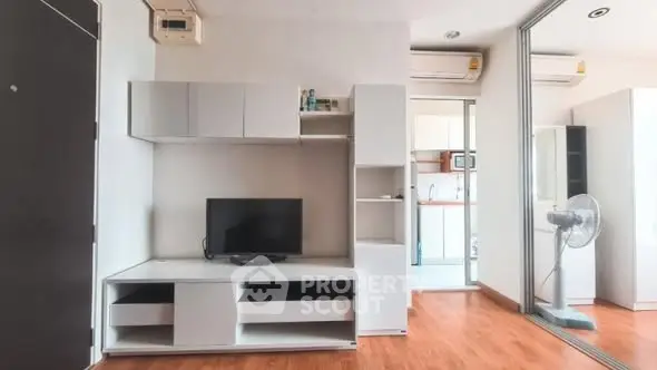 Modern living room with sleek furniture and wooden flooring