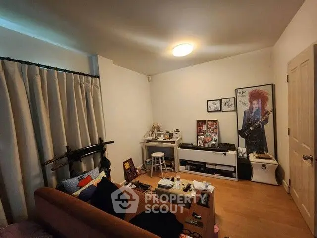 Cozy living room with eclectic decor and wooden flooring