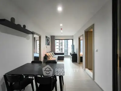 Modern open-plan living room with dining area in a stylish apartment