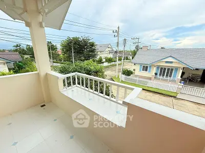 Charming balcony with scenic neighborhood view, perfect for relaxation and enjoying the outdoors.