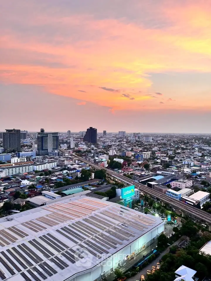 Stunning cityscape view at sunset showcasing urban skyline and vibrant sky colors.