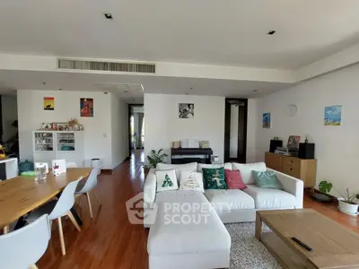 Spacious modern living room with stylish decor and wooden flooring