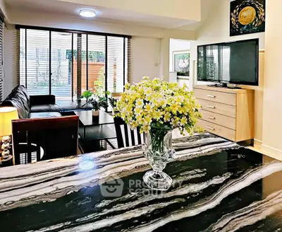 Stylish living room with modern decor and elegant marble countertop, perfect for contemporary living.